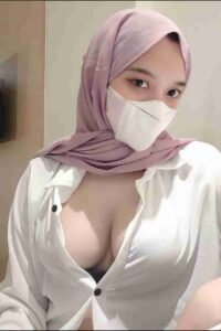 KL Escort Girl Woman in hijab and mask wearing a white shirt. Sex Service Malaysia