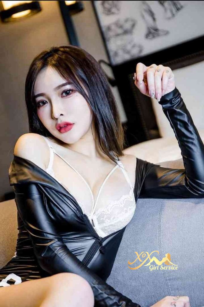 Attractive Asian woman in black outfit and white lingerie. KL escort girl. C cup.