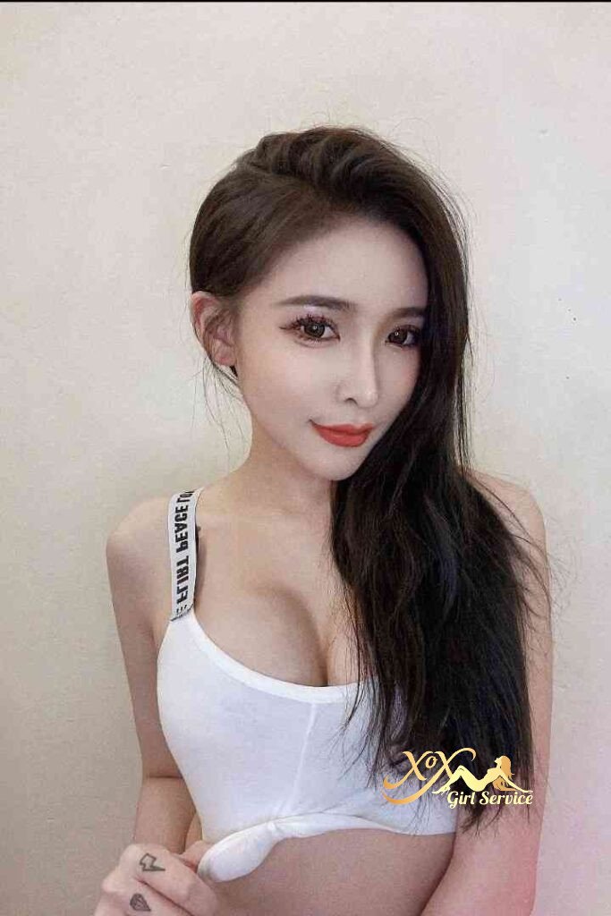 Attractive Asian woman in white top, long dark hair, red lipstick