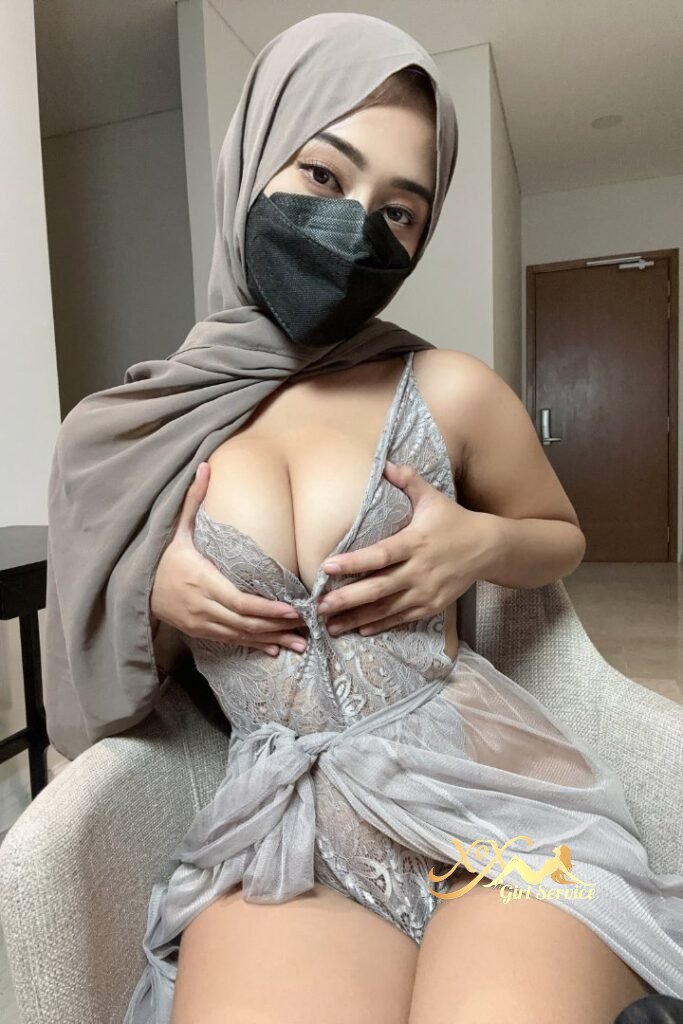 Malay girl in hijab and lingerie, wearing a mask.