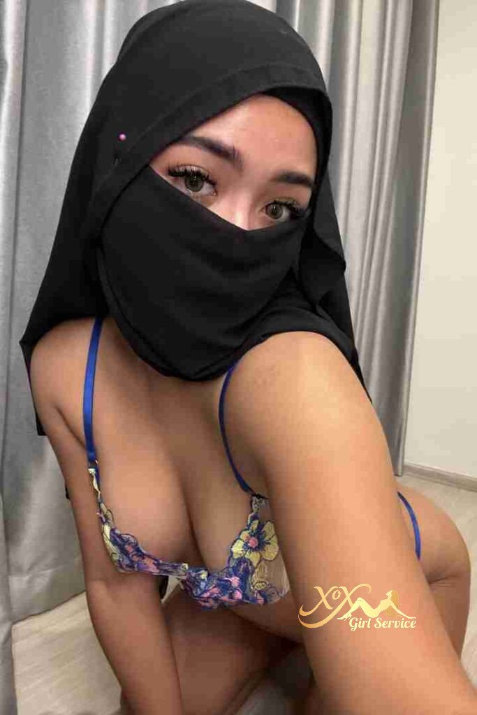Malay woman in hijab and bra. KL escort. C cup.