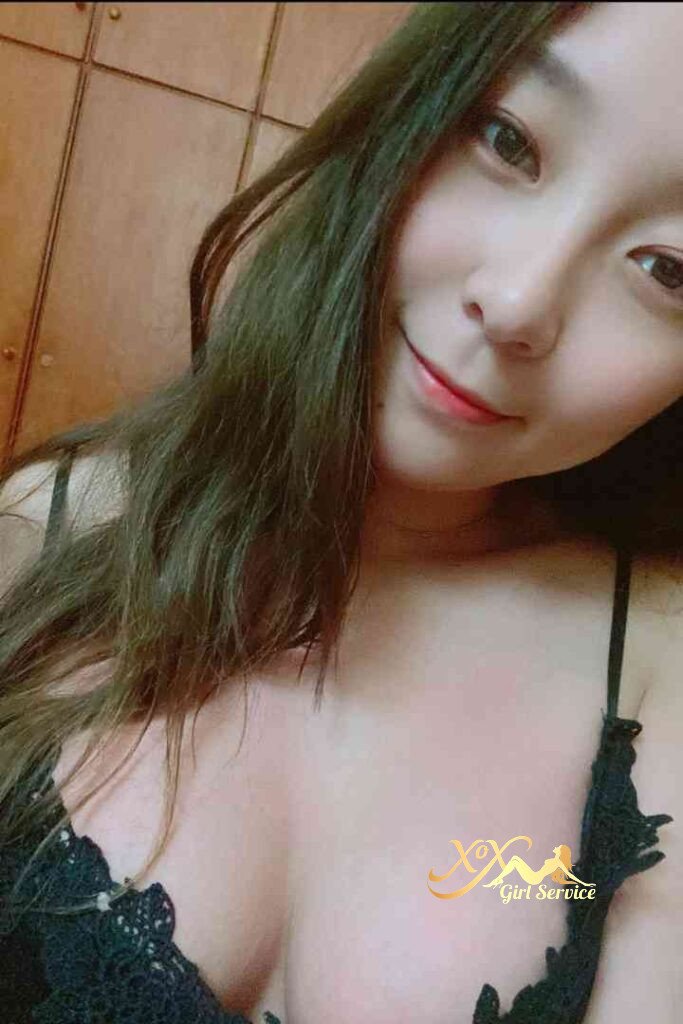 Petite Vietnamese woman in lingerie with a subtle smile. Kuala Lumpur incall/outcall.