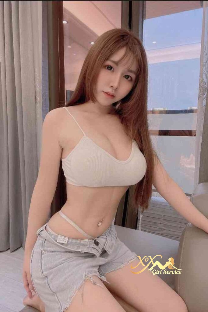 Sexy Vietnamese woman in bra and shorts, KL escort.