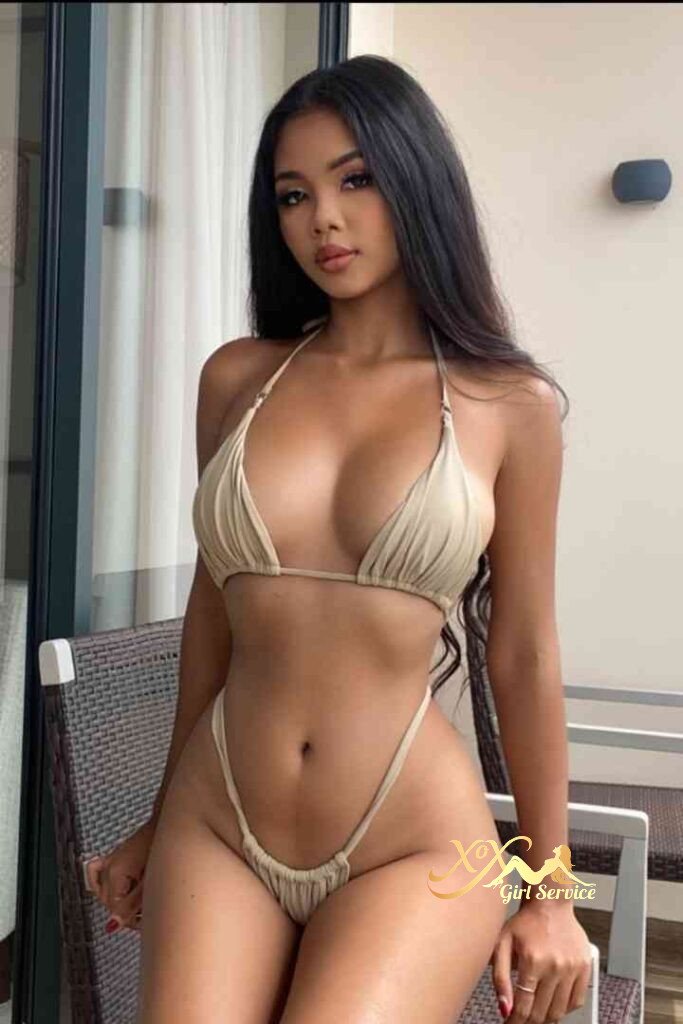 Seductive Thai escort Vanessa in KL wearing a beige bikini. Call girl services.